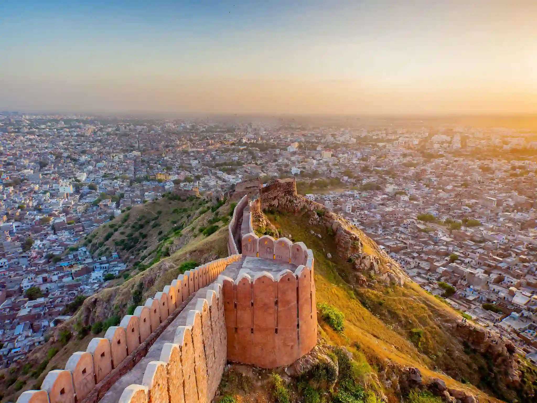 Jaipur cityscape view from Amer Fort with sunset glow.