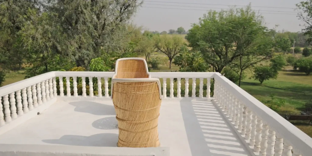 Terrace view with wicker chairs and greenery