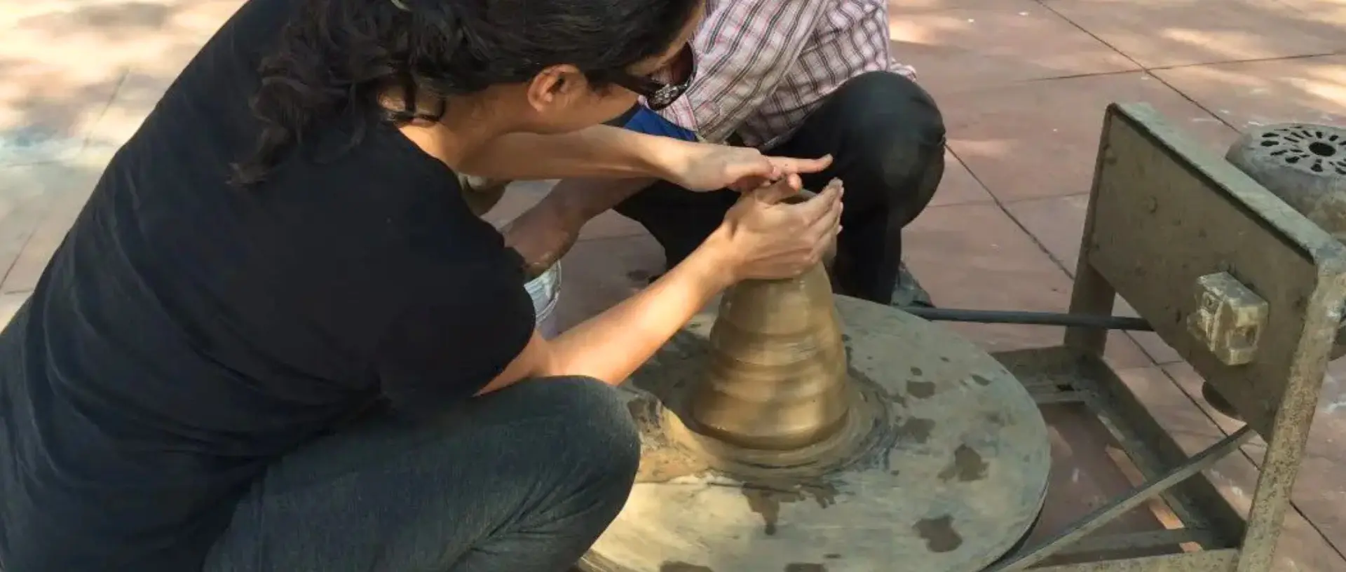 Female making pottery