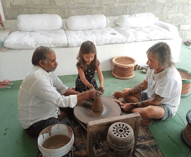 Group of people learning Pottery