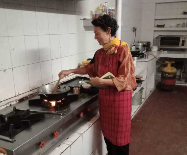 A lady taking Cooking Lessons