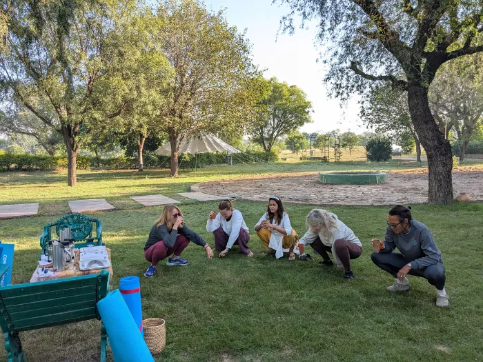 Group of people perfomrming Yogic Activity outdoor