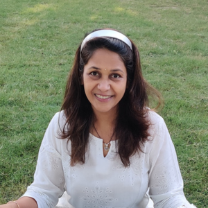 A female yoga teacher looking at Camera and Smiling