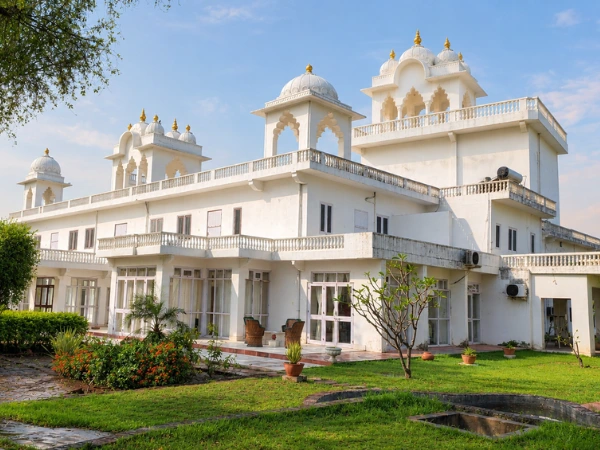 A peaceful evening view of a traditional Rajasthani heritage retreat courtyard.