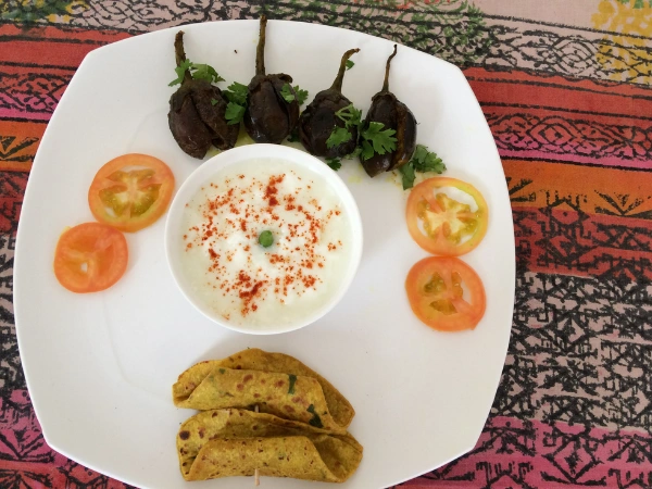 A freshly prepared Ayurvedic vegetarian meal featuring seasonal superfoods and farm-fresh ingredients.