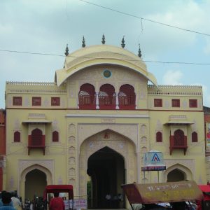 The iconic Tripolia Darwaza, royal entrance to the City Palace, with the Pink City bustling around it