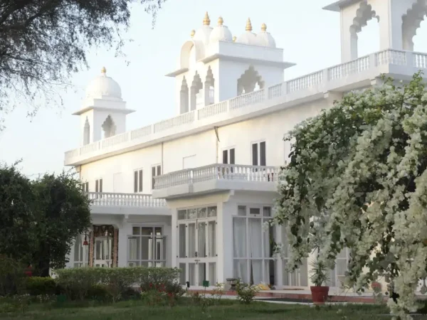 Savista Retreat, Jaipur: Elegant white facade of a luxury Rajasthani villa.