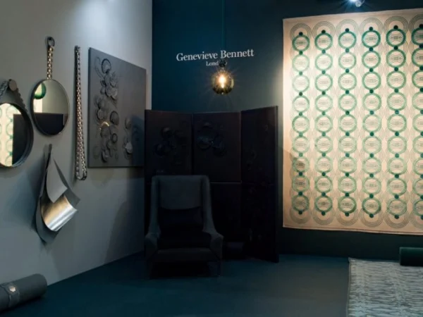 A modern interior design display showcasing artworks, mirrors, and a screen with geometric patterns